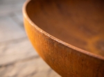Close-up of the corten steel rim and patina texture