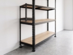 Black steel shelving unit seen from the side