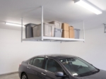 Ceiling storage rack above a parked car in a home garage