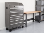 Tool chest beside a car with drawers partly open