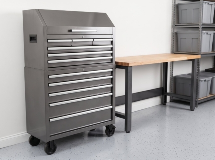 Tool chest beside a car with drawers partly open